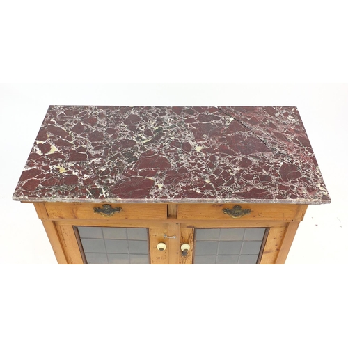 14 - Pine wash stand with marble top above a pair of leaded glazed doors, 76cm H x 110cm W x 52cm D