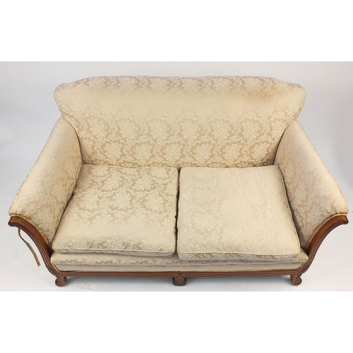 44 - Carved walnut framed two seater settee with beige upholstery, 89cm H x 156cm W x 86cm D