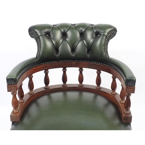 2008 - Mahogany framed green leather button back captains chair, 80cm high
