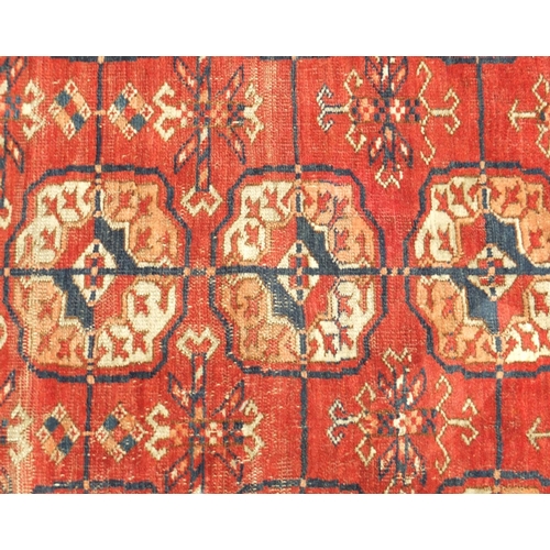 12 - Rectangular Persian rug having an all over geometric design, 200cm x 140cm