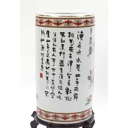 2037 - Large floor standing Chinese porcelain vase, on wooden stand, hand painted with flowers and script, ... 