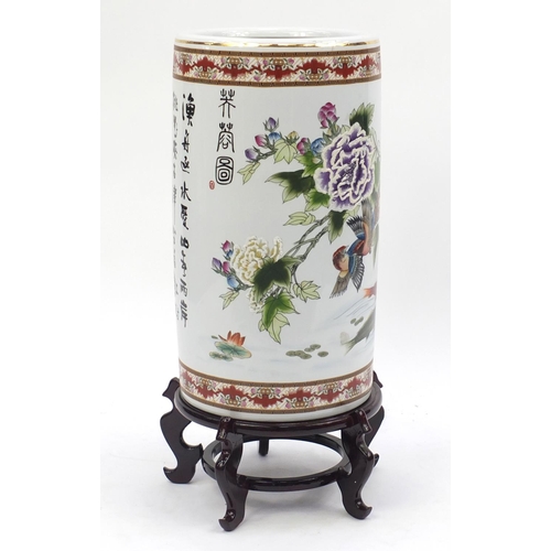 2037 - Large floor standing Chinese porcelain vase, on wooden stand, hand painted with flowers and script, ... 