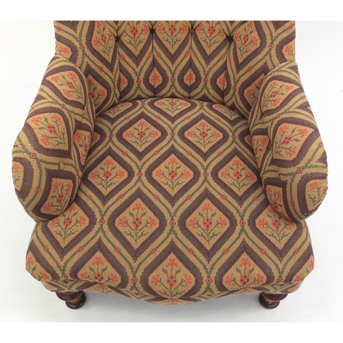 2010 - Victorian walnut framed lounge chair with stylised floral button back upholstery