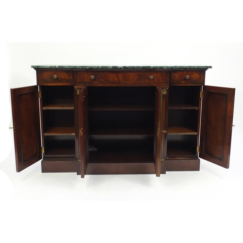 2007 - Mahogany break front side cabinet, with marble top above three frieze drawers, with lattice work pan... 