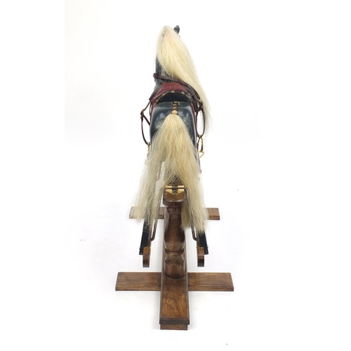 2011 - Child's wooden painted rocking horse, 85cm high