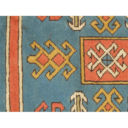 2026 - Turkish Milas rug having an all over geometric pattern onto a salmon ground, 210cm x 130cm