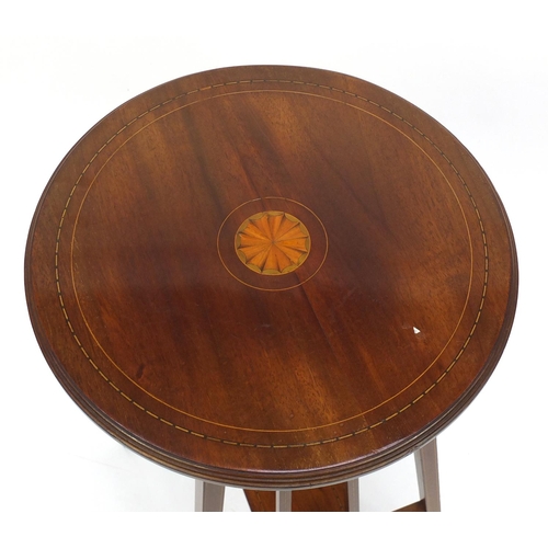 2036 - Circular Edwardian inlaid mahogany occasional table with under tier, 69cm high