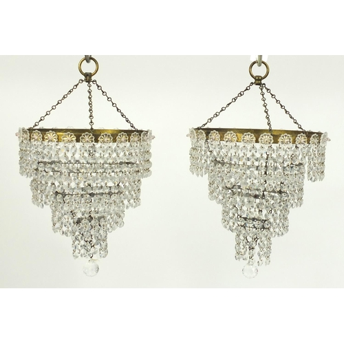 2047 - Pair of four tier glass and brass chandeliers, each 25cm in diameter