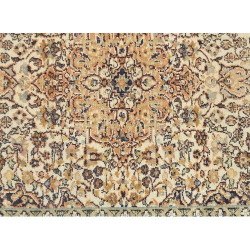 2020 - Rectangular Kashmere silk rug having all over floral motifs onto a beige ground, 125cm x 82cm