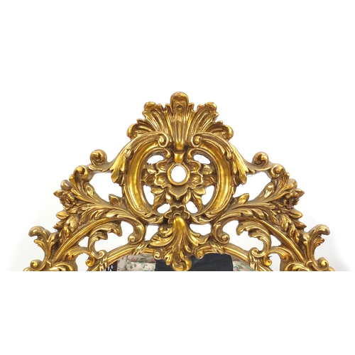 2030 - Ornate gilt framed over mantle mirror, decorated with C scrolls and acamphus leaves, 144cm x 76cm