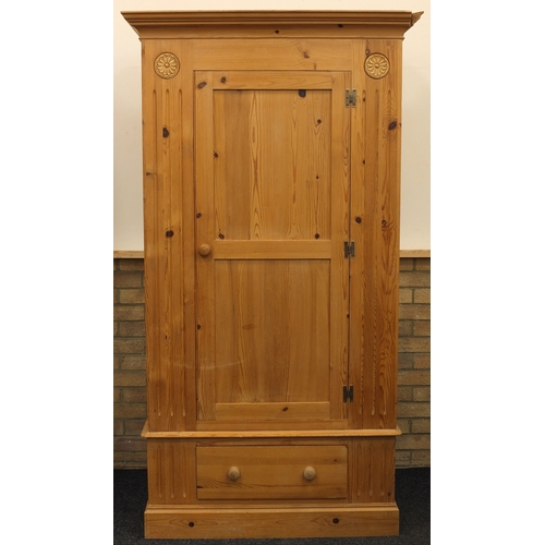 57 - Single pine wardrobe fitted with a drawer to the base, 200cm H x 110cm W x 60cm D