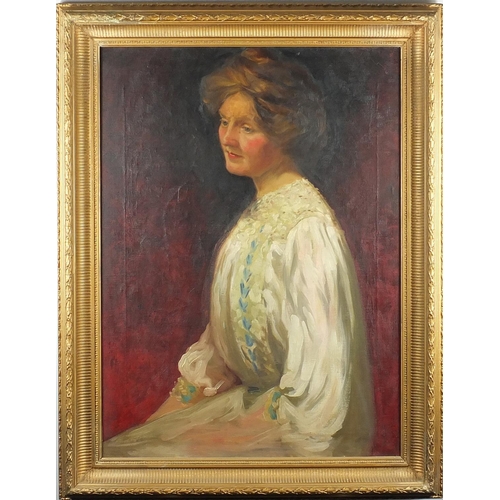 1392 - Top half portrait of a seated female, oil onto canvas, framed, 75cm x 55cm