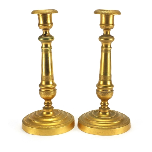 59 - Pair of 19th century French gilt brass candlesticks, 27cm high