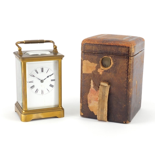 1128 - French brass cased carriage clock by Henri Jacot with enamelled dial and fitted travelling case, the... 