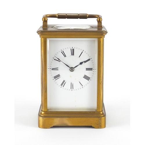 1128 - French brass cased carriage clock by Henri Jacot with enamelled dial and fitted travelling case, the... 