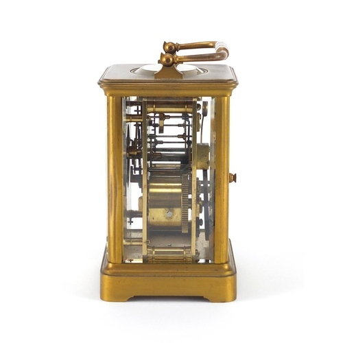 1128 - French brass cased carriage clock by Henri Jacot with enamelled dial and fitted travelling case, the... 