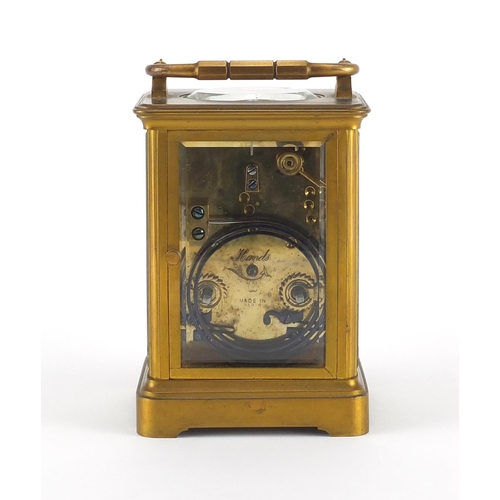 1128 - French brass cased carriage clock by Henri Jacot with enamelled dial and fitted travelling case, the... 