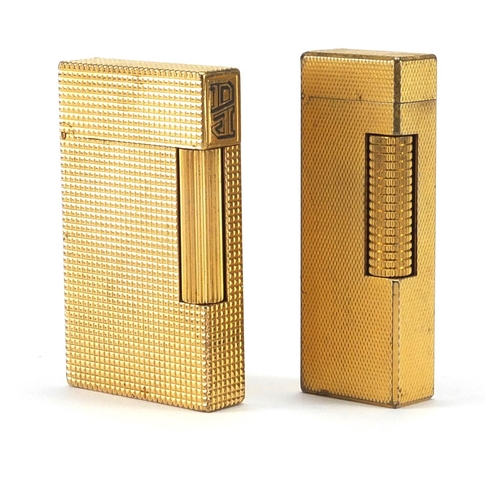 103 - Two gold plated pocket lighters by Dunhill and S T Dupont, the largest 6.5cm high