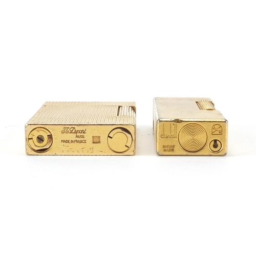 103 - Two gold plated pocket lighters by Dunhill and S T Dupont, the largest 6.5cm high