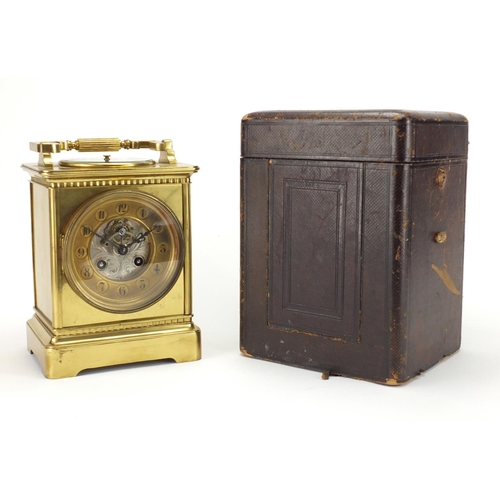 1125 - Brass cased carriage clock of large proportion, the top with inset aneroid barometer, together with ... 