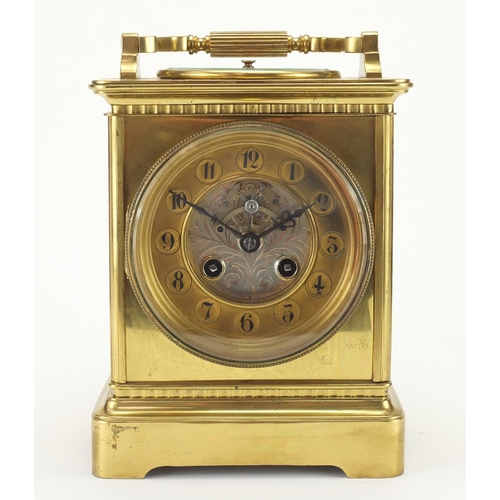 1125 - Brass cased carriage clock of large proportion, the top with inset aneroid barometer, together with ... 