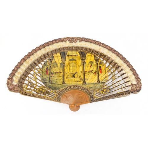 141 - 19th century pierced lacquered fan, the central sticks hand painted with a courtyard, the reverse wi... 