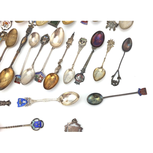 956 - Large selection of silver souvenir silver teaspoons some with enamelled terminals, including Cornwal... 