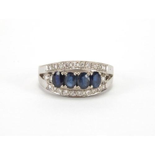 1022 - 18ct white gold sapphire and diamond ring, set with four sapphires and twenty three diamonds, size S... 