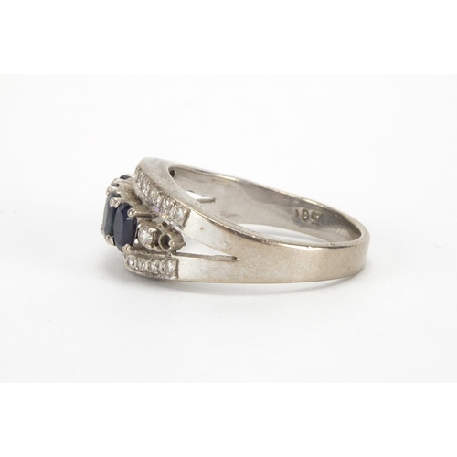 1022 - 18ct white gold sapphire and diamond ring, set with four sapphires and twenty three diamonds, size S... 