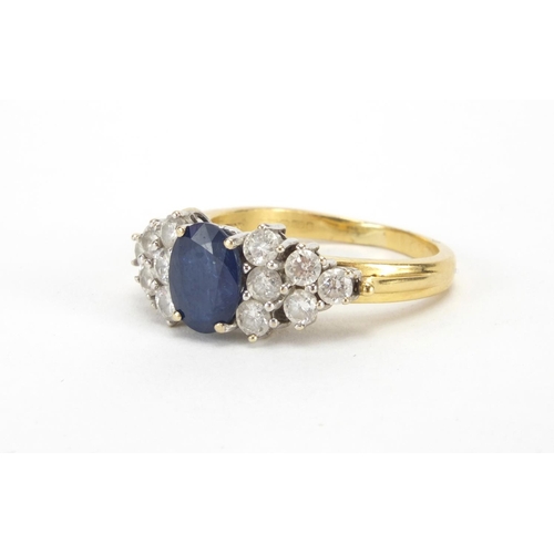 962 - 18ct gold sapphire and diamond ring set with a central sapphire and twelve diamonds, size N, approxi... 