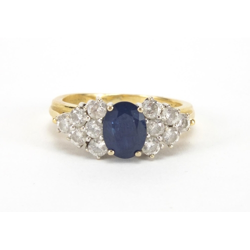 962 - 18ct gold sapphire and diamond ring set with a central sapphire and twelve diamonds, size N, approxi... 