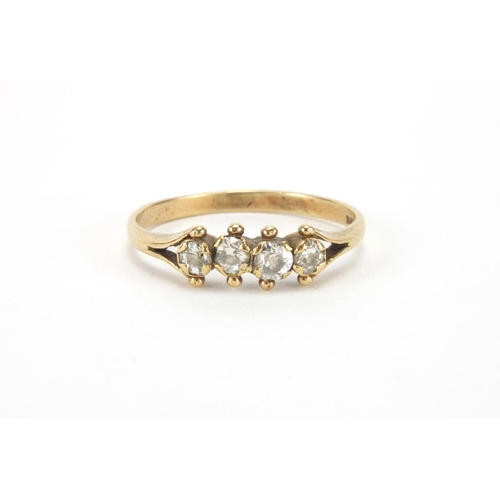 1026 - 9ct gold diamond four stone ring, size Q, approximate weight 1.8g