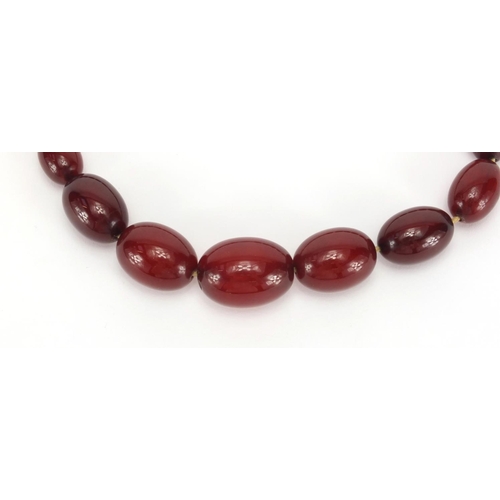 1059 - Cherry amber coloured bead necklace, 36cm in length, approximate weight 53.4g