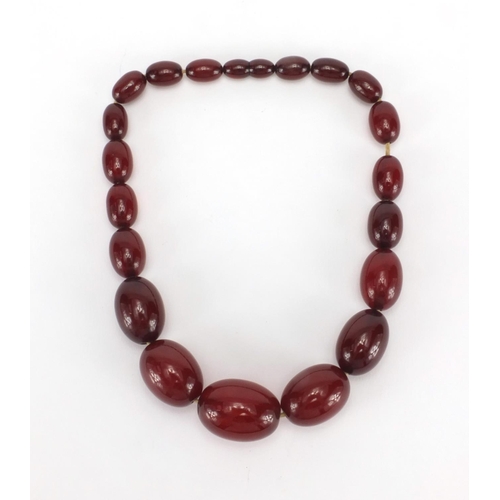 1059 - Cherry amber coloured bead necklace, 36cm in length, approximate weight 53.4g