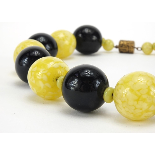 1063 - Splatted glass bead necklace, 40cm in length, approximate weight 226.8g