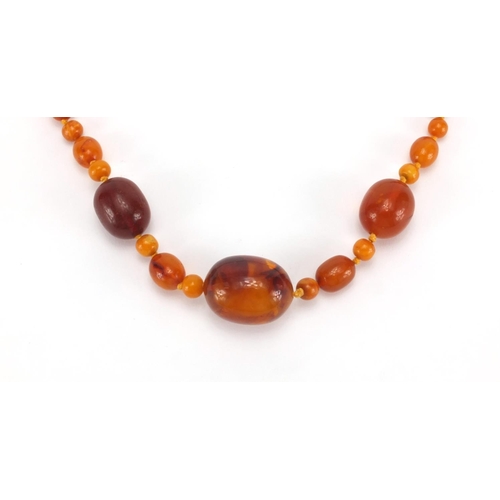 1055 - Natural and butterscotch amber coloured bead necklace, 80cm in length, approximate weight 40.5g