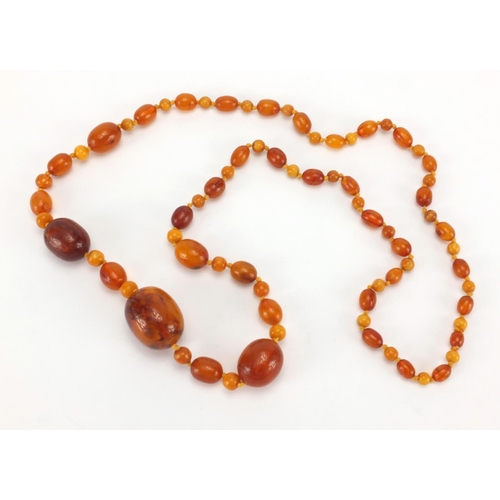 1055 - Natural and butterscotch amber coloured bead necklace, 80cm in length, approximate weight 40.5g