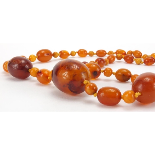 1055 - Natural and butterscotch amber coloured bead necklace, 80cm in length, approximate weight 40.5g