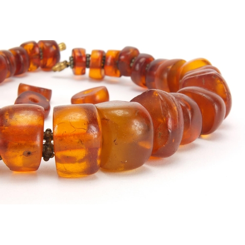 1057 - Amber coloured bead necklace, 38cm in length, approximate weight 102.6g