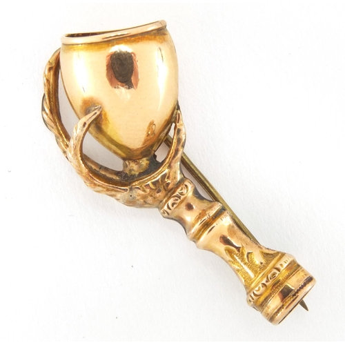 1027 - Victorian unmarked gold bird claw and chalice brooch, 4cm in length, approximate weight 3.3g