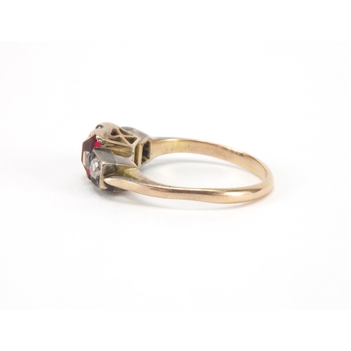 1007 - Unmarked gold red stone and diamond ring, size I, approximate weight 2.5g