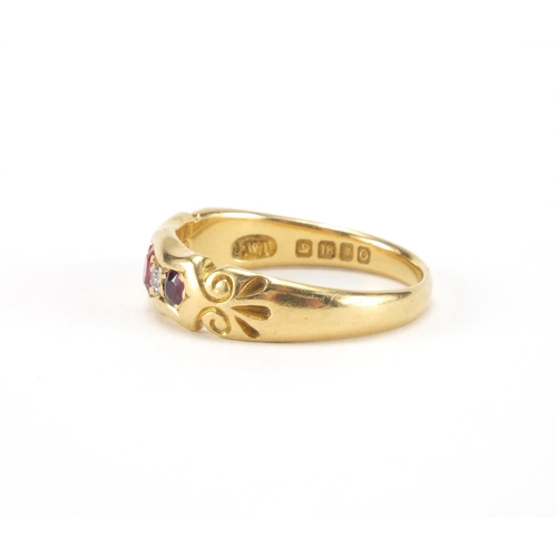 1014 - 18ct gold ruby an diamond ring set with three ruby's and two diamonds, size O, approximate weight 4.... 