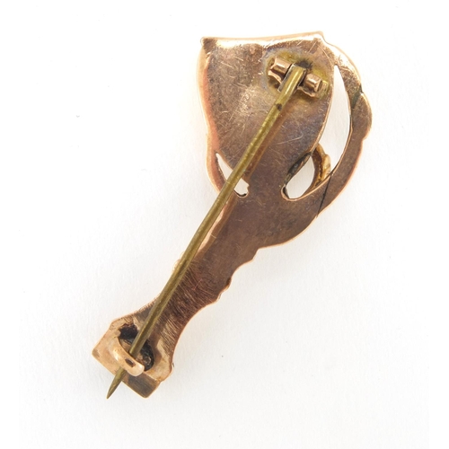 1027 - Victorian unmarked gold bird claw and chalice brooch, 4cm in length, approximate weight 3.3g