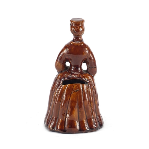 700 - Victorian treacle glazed pottery money box in the form of a crinoline lady, 18cm high