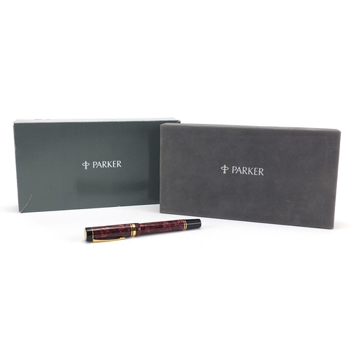 117 - Parker duofold centennial fountain pen in red marble with 18k gold nib and box
