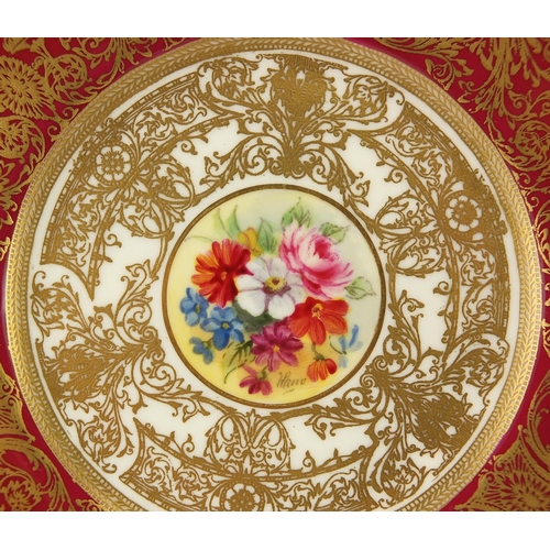 707 - Royal Worcester trio hand painted with flowers within gilt foliate boarders onto a red ground, signe... 