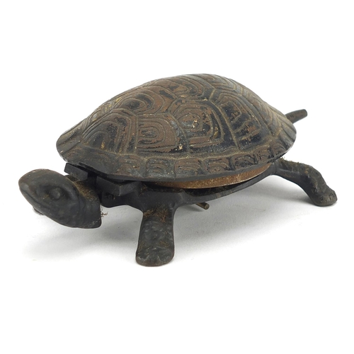 92 - Tortoise table bell with remnants of paint, 17cm in length