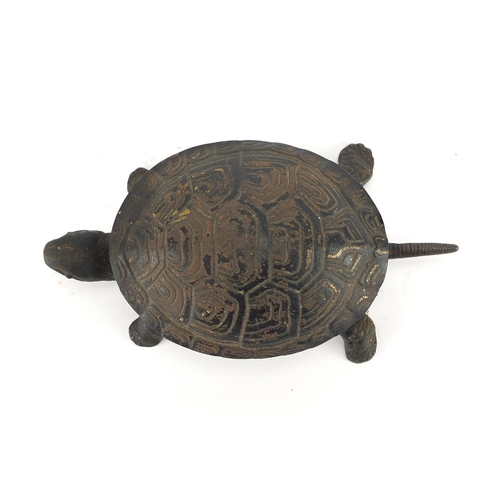 92 - Tortoise table bell with remnants of paint, 17cm in length