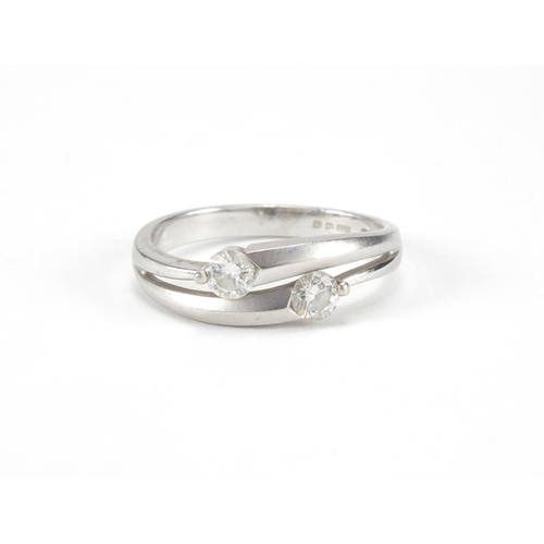 1005 - Platinum diamond crossover ring, size I, approximate weight 3.9