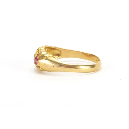 1043 - 18ct gold ruby and diamond ring set with three rubies and four diamonds, size Q, approximate weight ... 